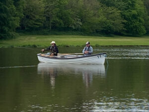 Two men in a boat, flyfishing